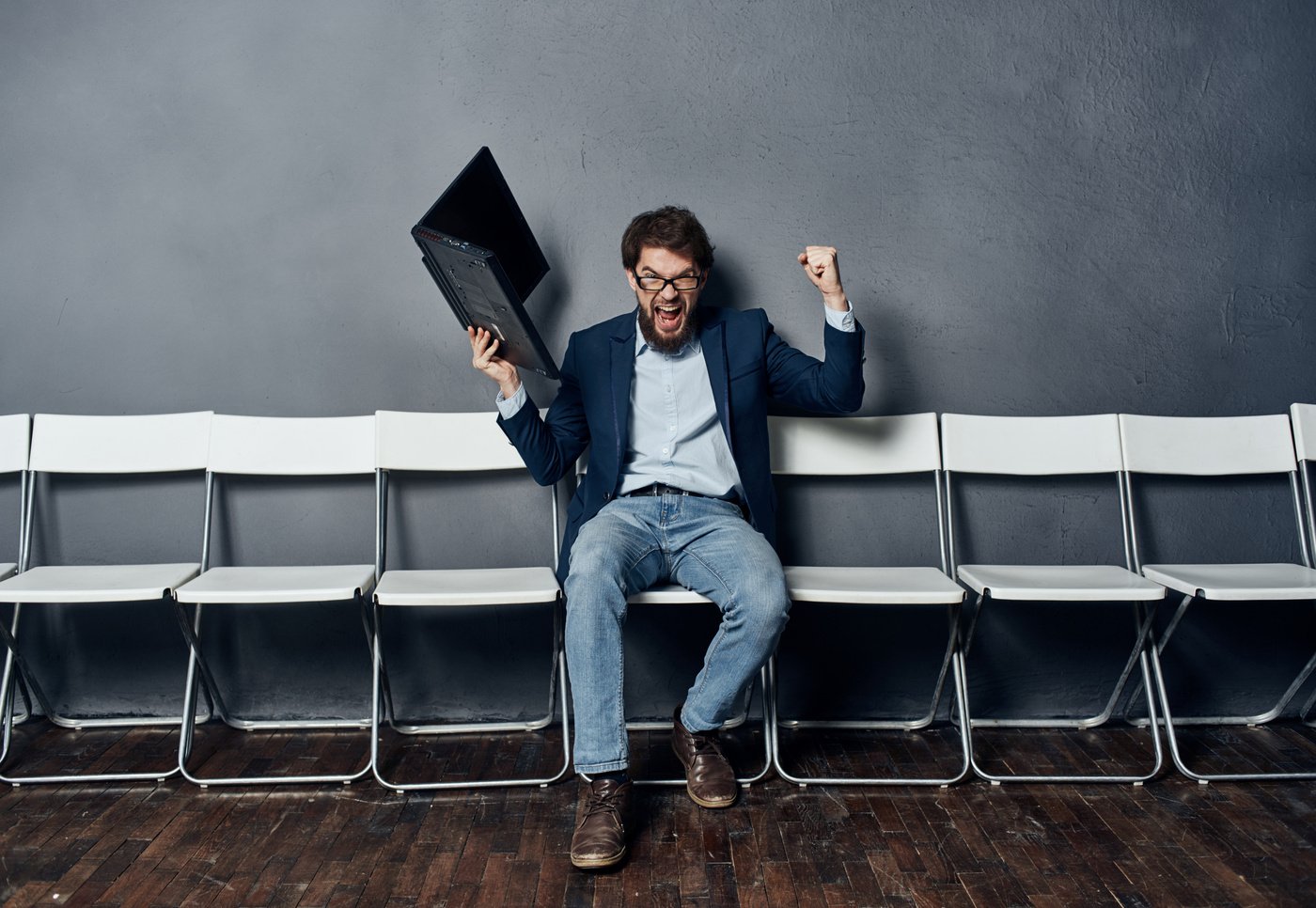 Emotional Man Sitting Alone at a Job Interview