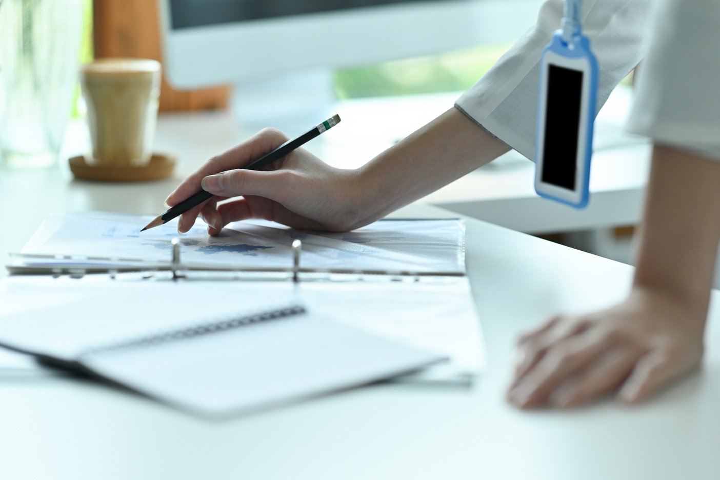 Cropped image of a young office woman standing and leaning o